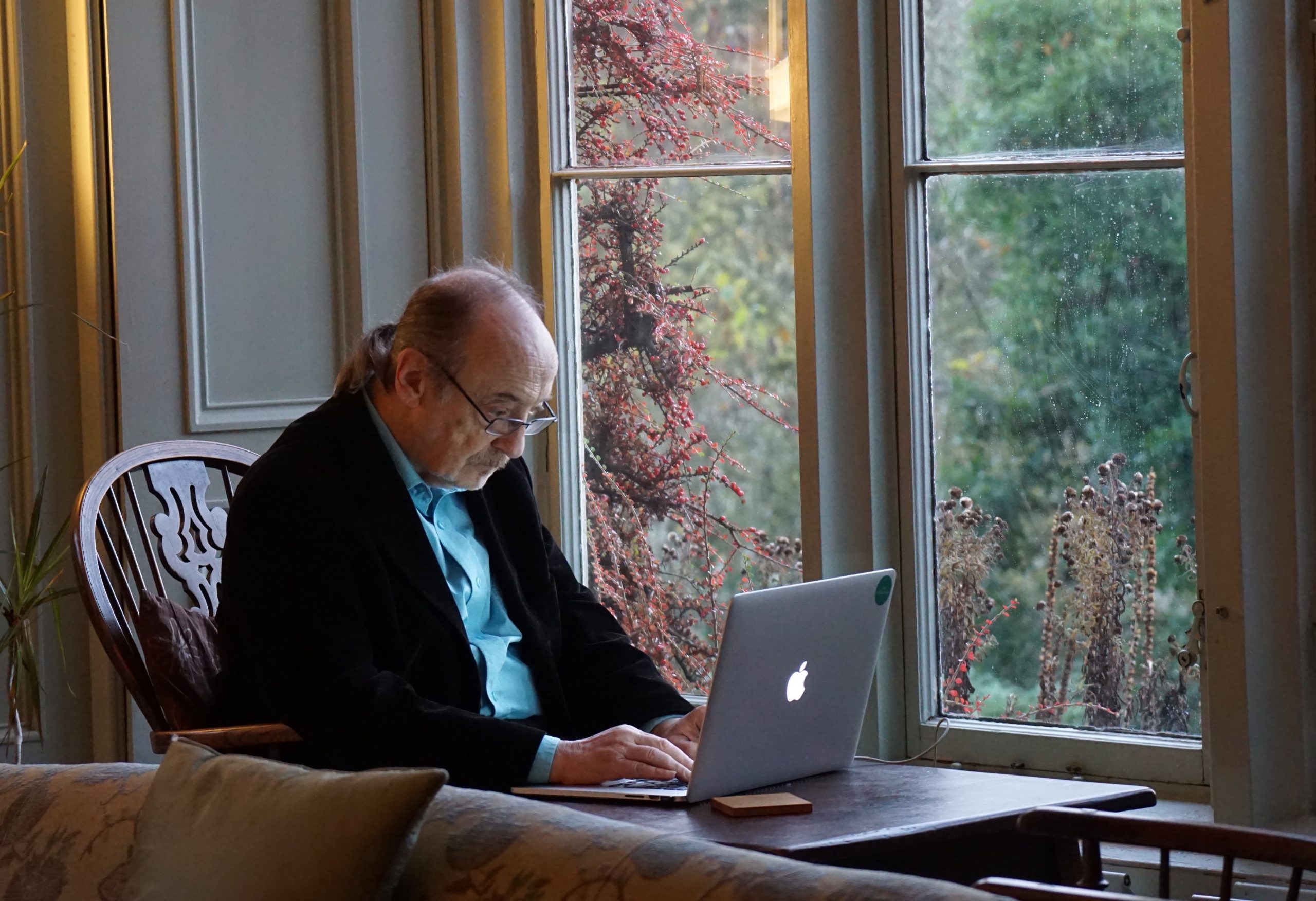 Picture of older man and computer from Unsplash