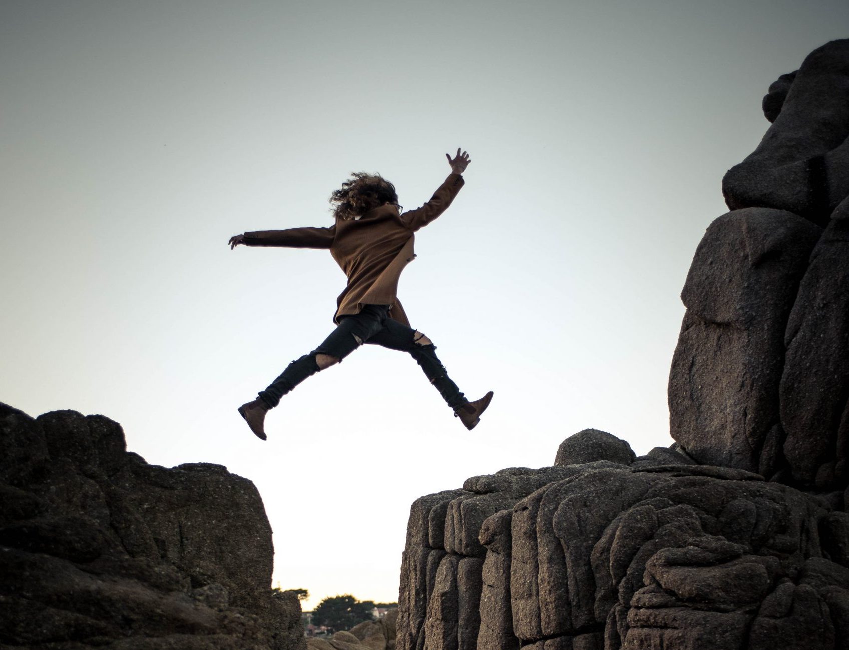 Picture of person jumping over cliffs