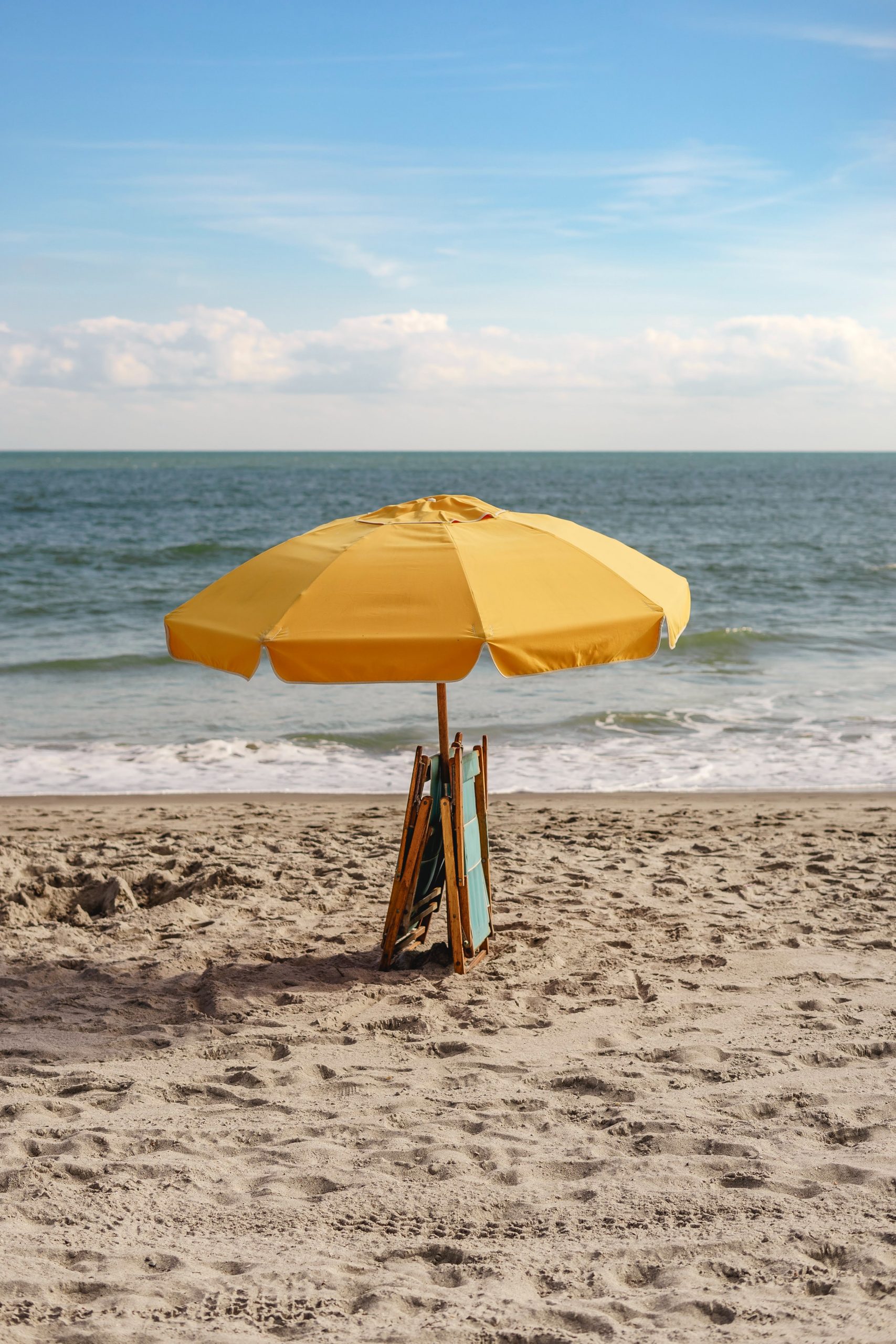 Yellow umbrella on the beach